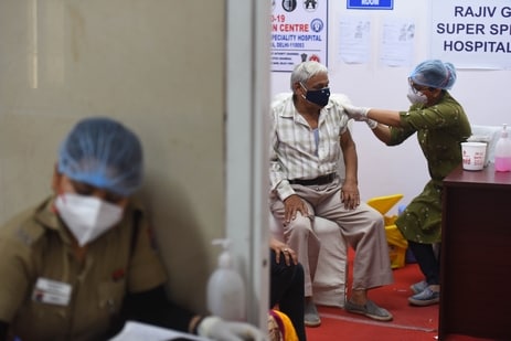 A health worker administers a dose of Covid-19 vaccine, at Rajiv Gandhi Super Specialty Hospital, in New Delhi. (Raj K Raj/ Hindustan Times)