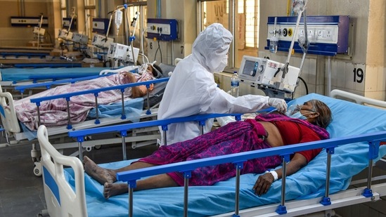 A health worker wearing PPE, attends to Covid-19 patients at a new 100 beds ICU Covid-19 Ward with Oxygen and Ventilator facilities, in Hyderabad, Tuesday, April 27, 2021. (PTI) A health worker wearing PPE, attends to Covid-19 patients at a new 100 beds ICU Covid-19 Ward with Oxygen and Ventilator facilities, in Hyderabad, Tuesday, April 27, 2021. (PTI)