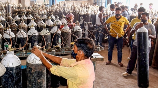The employees refilling cylinders at a medical oxygen plant in Patna on Wednesday. (PTI Photo ) The employees refilling cylinders at a medical oxygen plant in Patna on Wednesday. (PTI Photo )