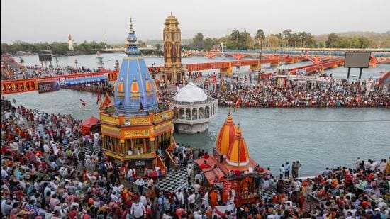 Devotees gather for evening prayer on the banks of the Ganges river during Kumbh Mela in Haridwar on April 13. (File photo)