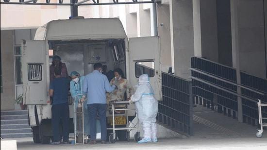 A patient being shifted to a dedicated Covid-19 facility in Sector 48, Chandigarh, on Wednesday. (Ravi Kumar/HT)