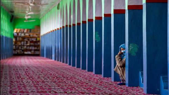 Srinagar: A woman looks on at the deserted shrine of Sheikh Hamzah Makhdoomi (PTI)