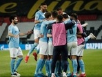 Manchester City's Kevin De Bruyne celebrates scoring their first goal with Riyad Mahrez and teammates.