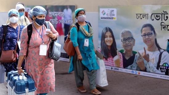 Polling officials carrying EVMs and other polling materials on the eve of the 8th phase of the West Bengal Assembly election on Wednesday. (ANI Photo) Polling officials carrying EVMs and other polling materials on the eve of the 8th phase of the West Bengal Assembly election on Wednesday. (ANI Photo)