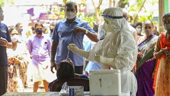 Kozhikode: Health workers take swab samples for COVID-19 testing as coronavirus cases surge in Kerala. (PTI)