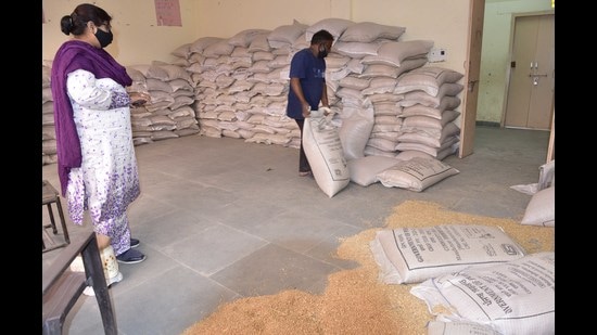 At Government Model Senior Secondary Smart School, Punjab Agricultural University, more than 50 bags of wheat and rice have been lying in two rooms for over a month. (HT Photo)