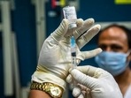 A health worker prepares to administer the COVAXIN vaccine for Covid-19 to a man at an indoor stadium in Guwahati, India, Thursday, April 22, 2021. (AP) A health worker prepares to administer the COVAXIN vaccine for Covid-19 to a man at an indoor stadium in Guwahati, India, Thursday, April 22, 2021. (AP)