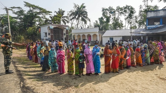 Voters in queues to cast their votes during the second phase of West Bengal Assembly polls, in Nandigram on April 1. A monthlong poll season that began with a tense political battle between the Bharatiya Janata Party (BJP) and Trinamool Congress (TMC) but was quickly overshadowed by surging Covid-19 infections came to an end on April 29 with the conclusion of the eighth phase of voting.(Ashok Bhaumik / PTI)