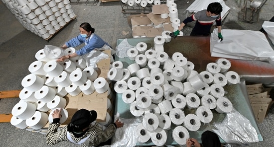 Workers are seen on the production line at a cotton textile factory in Korla, Xinjiang Uighur Autonomous Region, China(REUTERS )