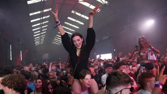 People enjoy their time at a nightclub, as part of a national research programme assessing the risk of Covid-19 transmission, in Liverpool. (REUTERS)