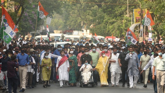 Chief Minister of West Bengal and Trinamool Congress leader Mamata Banerjee with Samajwadi Party MP Jaya Bachchan during an election rally with TMC candidates from Beleghata to Bowbazar in Kolkata on April 15. All parties contesting the election were observed flouting Covid-19 safety protocols during the drawn-out poll season.(Samir Jana / HT Photo)