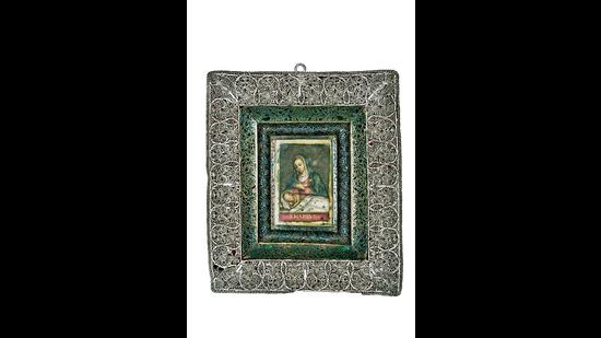 A 17th-century painting of the Virgin and Child framed with paisley patterns and silver filigree.  (Image provided by MoCA)