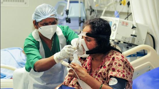 File photo: A health worker looks after a Covid-19 patient on oxygen support at a hospital. (PTI) File photo: A health worker looks after a Covid-19 patient on oxygen support at a hospital. (PTI)