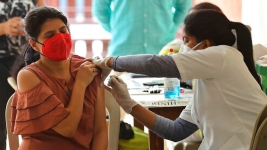A woman receives the AstraZeneca vaccine for Covid-19 at an apartment building in Bengaluru.(AP File Photo )