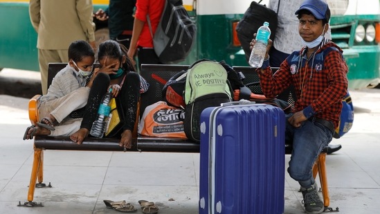 Children of migrant workers wait for transportation at a bus station during a lockdown in New Delhi, India, Friday, April 30, 2021. (AP) Children of migrant workers wait for transportation at a bus station during a lockdown in New Delhi, India, Friday, April 30, 2021. (AP)