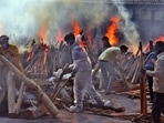 People who died of Covid-19 being cremated at Ghazipur crematorium in New Delhi, India, on Saturday, May 1, 2021. (Photo by Raj K Raj/ Hindustan Times)(Raj K Raj/HT PHOTO) People who died of Covid-19 being cremated at Ghazipur crematorium in New Delhi, India, on Saturday, May 1, 2021. (Photo by Raj K Raj/ Hindustan Times)(Raj K Raj/HT PHOTO)