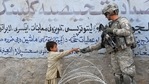 In this file photo taken on February 20, 2010, a US soldier from 4th Infantry Division 4 Brigade Alpha Company presents a gift to an Afghan child during a patrol at Khogyani in Nangarhar. (Photo by KIM JAE-HWAN / AFP) In this file photo taken on February 20, 2010, a US soldier from 4th Infantry Division 4 Brigade Alpha Company presents a gift to an Afghan child during a patrol at Khogyani in Nangarhar. (Photo by KIM JAE-HWAN / AFP)