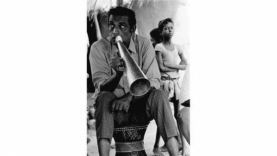 In this photograph from 1963, photographer Nemai Ghosh captures director Satyajit Ray on a film set. Ghosh was most known for chronicling the life and works of Satyajit Ray in his photographic work. ( Image courtesy: DAG)