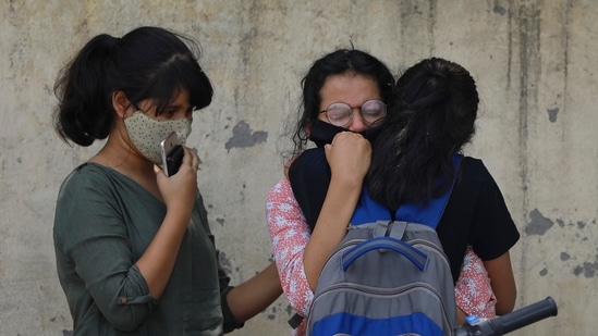 Relatives of a person who died of Covid-19 mourn at a crematorium in New Delhi, on April 30. Deaths from Covid-19 jumped by 3,523 over the past 24 hours, taking the total toll to 211,853, according to health ministry data.(AP Photo)