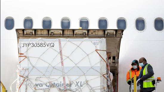 Ground crew unload a shipment from South Africa of the Johnson & Johnson vaccine at Toronto Pearson Airport in Mississauga, Ontario, Canada, on April 28. (REUTERS)