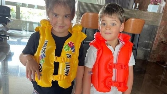 Karan Johar's kids Yash and Roohi pose for the camera. Karan Johar's kids Yash and Roohi pose for the camera.