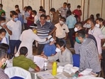 2021 Assam Election Results LIVE Updates: Officials wait for their turn to undergo Covid-19 test ahead of the counting of votes.(PTI Photo) 2021 Assam Election Results LIVE Updates: Officials wait for their turn to undergo Covid-19 test ahead of the counting of votes.(PTI Photo)