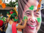 Trinamool Congress supporters celebrate their party’s victory in the assembly elections, in South Dinajpur district on Sunday. (PTI Photo)(PTI) Trinamool Congress supporters celebrate their party’s victory in the assembly elections, in South Dinajpur district on Sunday. (PTI Photo)(PTI)