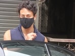 Tiger Shroff was seen in Santacruz on Sunday with half his face covered behind a black mask.(Varinder Chawla)