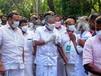 Kerala chief minister Pinarayi Vijayan greets other leaders and supporters as he arrives at a vote counting center following LDF's victory, in Kannur, Kerala. (AP)