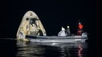 Support teams work around the SpaceX Crew Dragon Resilience spacecraft shortly after it landed with NASA astronauts.(AP) Support teams work around the SpaceX Crew Dragon Resilience spacecraft shortly after it landed with NASA astronauts.(AP)