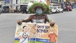 West Bengal Election Results 2021: A TMC supporter holds a placard outside West Bengal chief minister Mamata Banerjee's residence during the counting of votes in Kolkata on Sunday(PTI) West Bengal Election Results 2021: A TMC supporter holds a placard outside West Bengal chief minister Mamata Banerjee's residence during the counting of votes in Kolkata on Sunday(PTI)