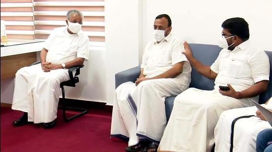 Kerala chief minister Pinarayi Vijayan watches the election trends along with party members, in Thiruvananthapuram on Sunday, May 2. (ANI)