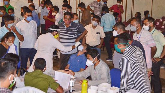 Assam officials took Covid-19 tests before the counting day for assembly elections 2021. (PTI) Assam officials took Covid-19 tests before the counting day for assembly elections 2021. (PTI)