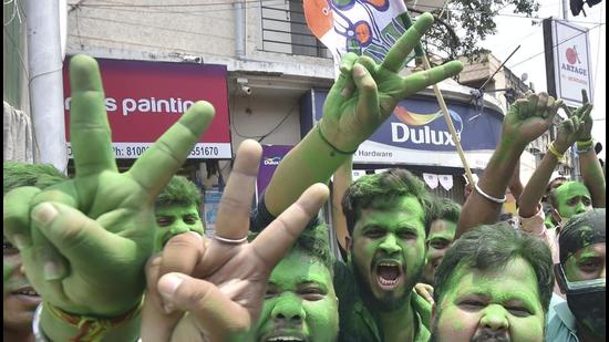 TMC activists celebrate their party's winning trend during the West Bengal state assembly polls, in Kolkata on Sunday, May 2. (PTI) TMC activists celebrate their party's winning trend during the West Bengal state assembly polls, in Kolkata on Sunday, May 2. (PTI)