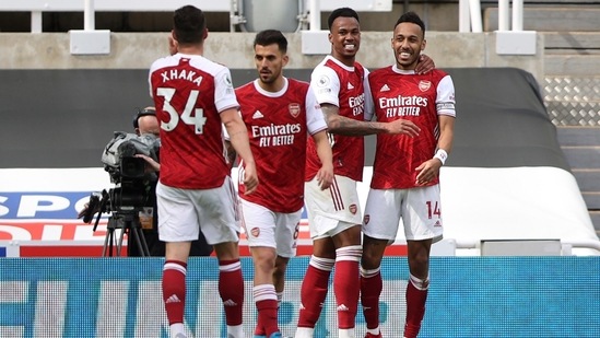 Arsenal's Pierre-Emerick Aubameyang, right, celebrates scoring his side's second goal with his teammates.(AP)