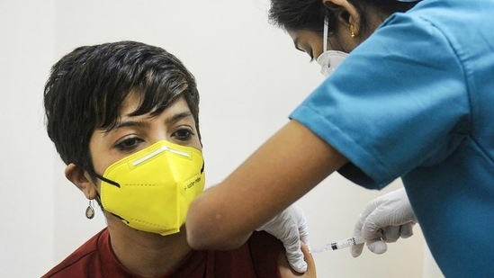 A medical worker inoculates a young woman with a dose of the Covid-19 vaccine at a vaccination centre. (PTI file photo) A medical worker inoculates a young woman with a dose of the Covid-19 vaccine at a vaccination centre. (PTI file photo)