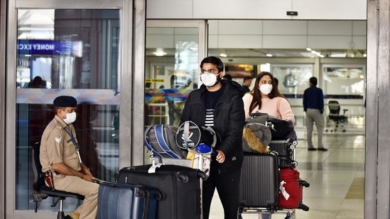 People seen wearing protective face masks as a precautionary measure amid Covid-19 pandemic at Indira Gandhi International Airport, Delhi.(Sanjeev Verma/HT PHOTO) People seen wearing protective face masks as a precautionary measure amid Covid-19 pandemic at Indira Gandhi International Airport, Delhi.(Sanjeev Verma/HT PHOTO)