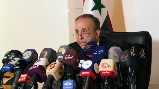Head of the higher constitutional court, Jihad Al Laham, speaks during a news conference in Damascus, Syria May 3, 2021. (Firas Makdesi / REUTERS)