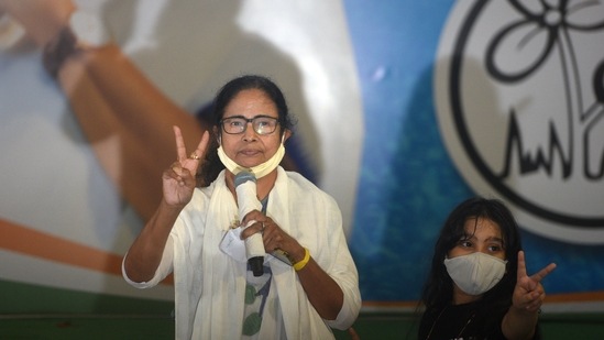 TMC chief and West Bengal Chief Minister Mamata Banerjee shows the victory sign along with her grandniece Azania during a media interaction at her residence in Kalighat, Kolkata, on May 2. “It is the victory of the people of Bengal, the victory of democracy. Bengal has saved India today. This landslide victory came after fighting against several odds — the Centre, its machinery, its agencies. This victory has saved the humanity,” Banerjee said.(Samir Jana / HT Photo)