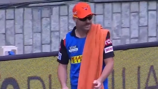 David Warner carrying drinks during the match against Rajasthan Royals on Sunday(Twitter)