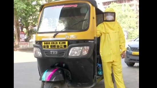 The image shows Dattatraya Sawant beside his auto-ricksaw. (ANI) The image shows Dattatraya Sawant beside his auto-ricksaw. (ANI)