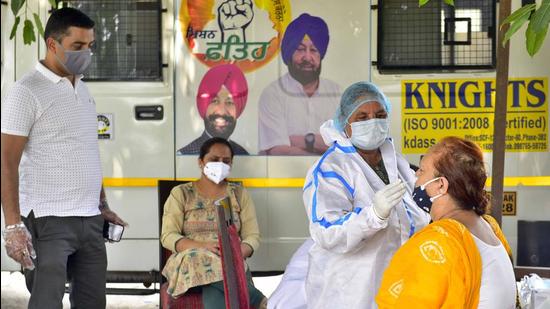 A health worker collects a swab sample at a testing camp in Ludhiana’s Sarabha Nagar on Monday. (Gurpreet Singh/Hindustan Times) A health worker collects a swab sample at a testing camp in Ludhiana’s Sarabha Nagar on Monday. (Gurpreet Singh/Hindustan Times)