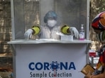 A health worker at a swab collection booth for Covid-19 tests in Hyderabad on May 3. India on May 4 registered 357,229 new Covid-19 cases in the preceding 24 hours, taking the country's total coronavirus infection tally past the 20-million mark, according to the .health ministry's data.(Mahesh Kumar A / AP)