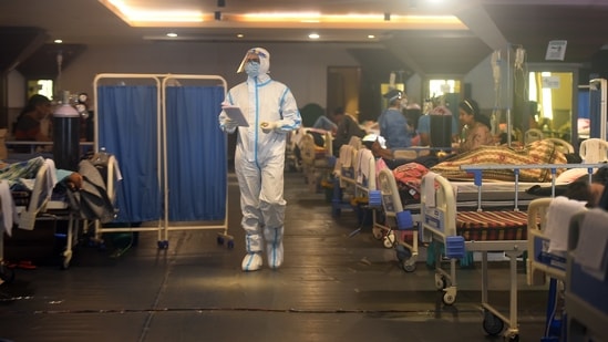 A health worker on the rounds at the temporary Covid care centre at Shehnai Banquet Hall in New Delhi, on May 1. According to the government, India’s recovery rate from the disease currently stands at 81.77% and the fatality rate stands at 1.10%.(Raj K Raj / HT Photo)