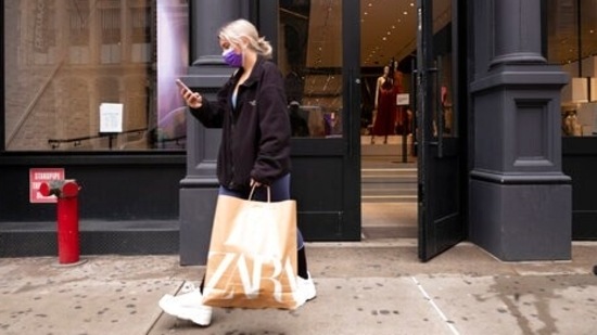A customer walks out of a Zara store, Thursday, March 25, 2021, (AP)