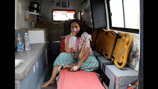 A patient with breathing problems wears an oxygen mask as she waits inside an ambulance in a queue to enter a COVID-19 hospital, amidst the coronavirus disease pandemic, Ahmedabad, India, April 14, 2021. REUTERS/Amit Dave (REUTERS)