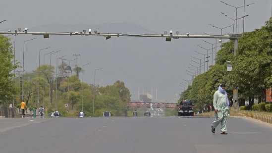 A man walks through a deserted Expressway in Islamabad earlier this month. Pakistan is reeling under the third wave of the deadly coronavirus disease (Covid-19).(AFP) A man walks through a deserted Expressway in Islamabad earlier this month. Pakistan is reeling under the third wave of the deadly coronavirus disease (Covid-19).(AFP)