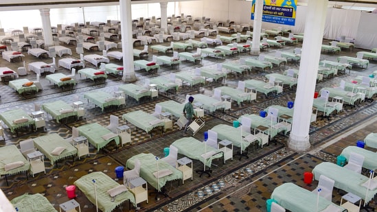 New Delhi: Volunteers set up an under-construction temporary Covid-19 Care Centre of 200 beds with oxygen support, amid the ongoing second wave of coronavirus pandemic, at Gurudwara Rakab Ganj Sahib in New Delhi, Monday, May 3, 2021. (PTI)