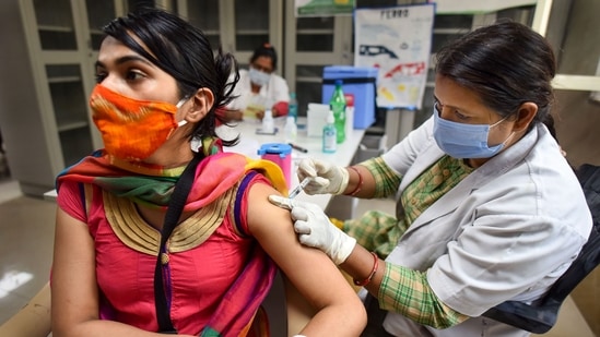 Prayagraj: A health worker administers COVID-19 vaccine to a woman, at the Moti Lal Nehru Medical College in Prayagraj, Tuesday, May 4, 2021. (PTI) Prayagraj: A health worker administers COVID-19 vaccine to a woman, at the Moti Lal Nehru Medical College in Prayagraj, Tuesday, May 4, 2021. (PTI)