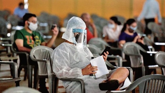 People aged 18 and above wait at a vaccination centre at Radha Soami Satsang grounds, on Tuesday. Sanjeev Verma/HT PHOTO People aged 18 and above wait at a vaccination centre at Radha Soami Satsang grounds, on Tuesday. Sanjeev Verma/HT PHOTO
